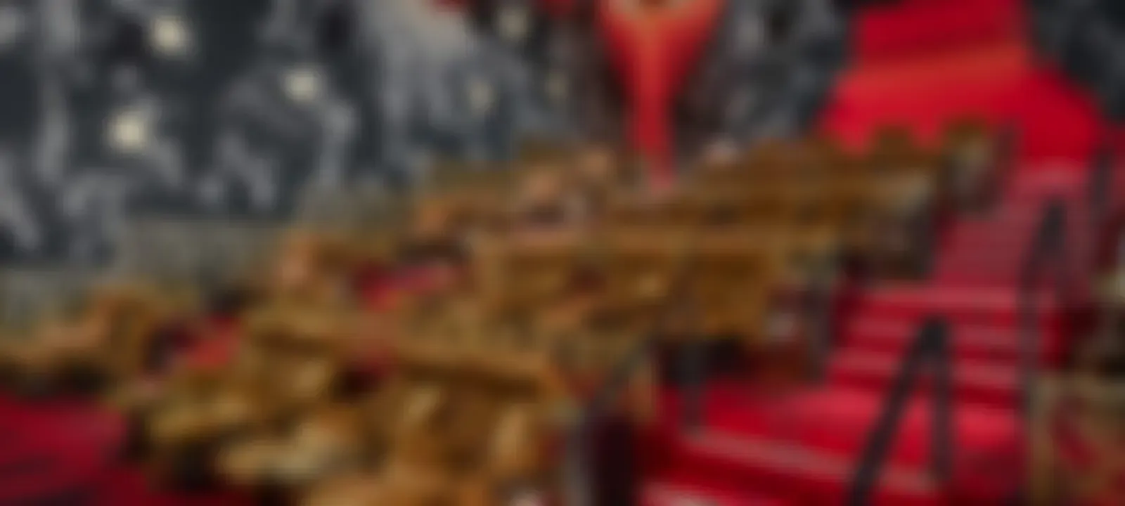 Red cinema seats, softly out of focus